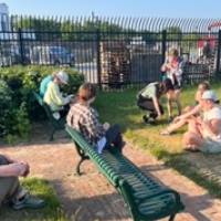 Beaver Island Participants rest on a bench in town